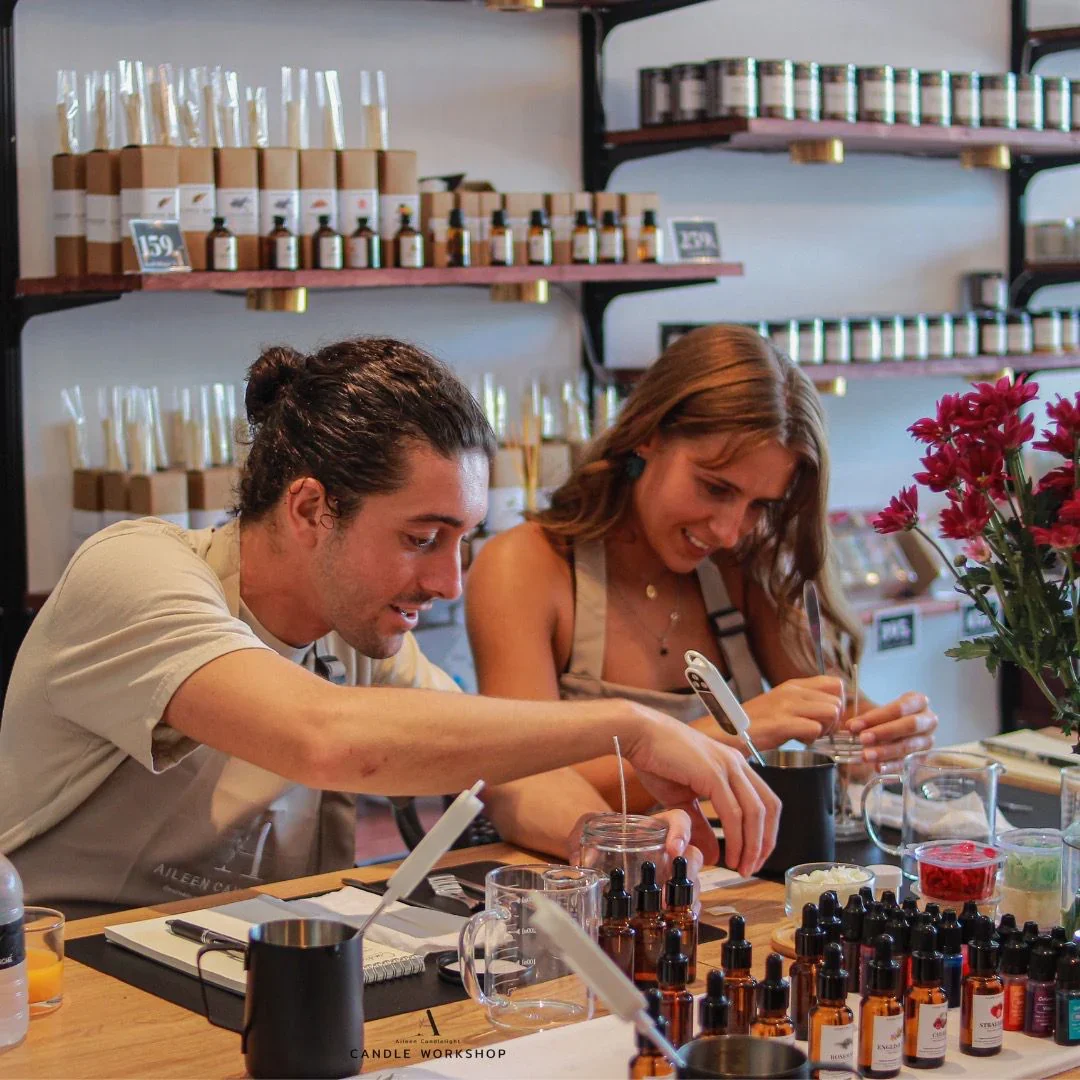 Two guests blend fragrances at the Aileen Candlelight workshop in Ao Nang.